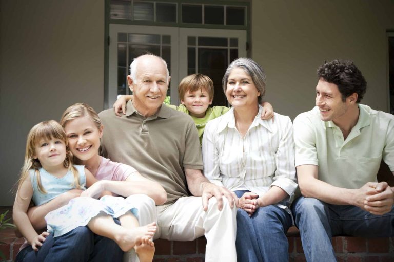 group picture of three generations family sitting on the terrace 1
